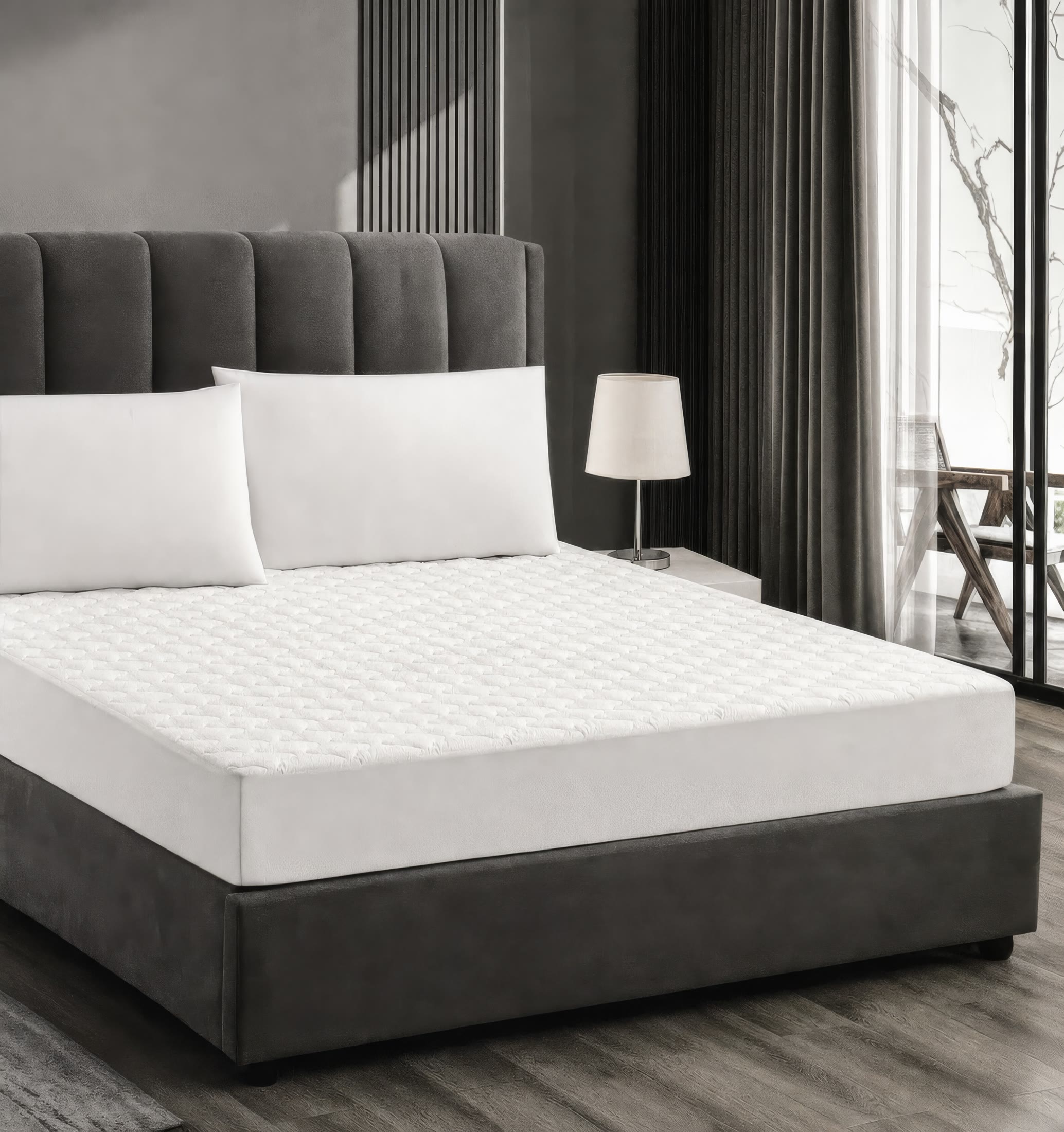 White quilted mattress protector on a modern bed